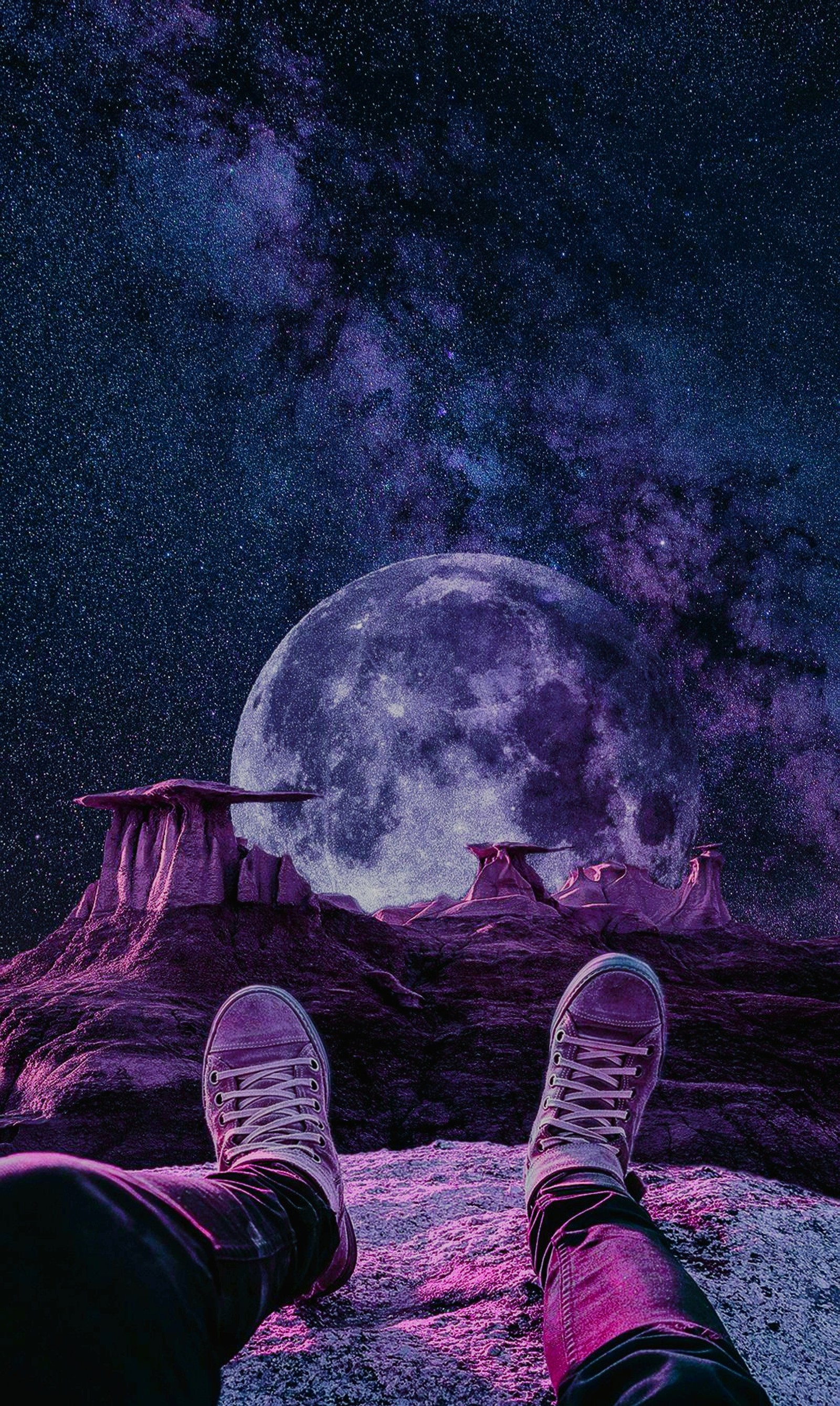 Someone is sitting on a rock with their feet up in the air (galaxy, nebula, purple, space, view)