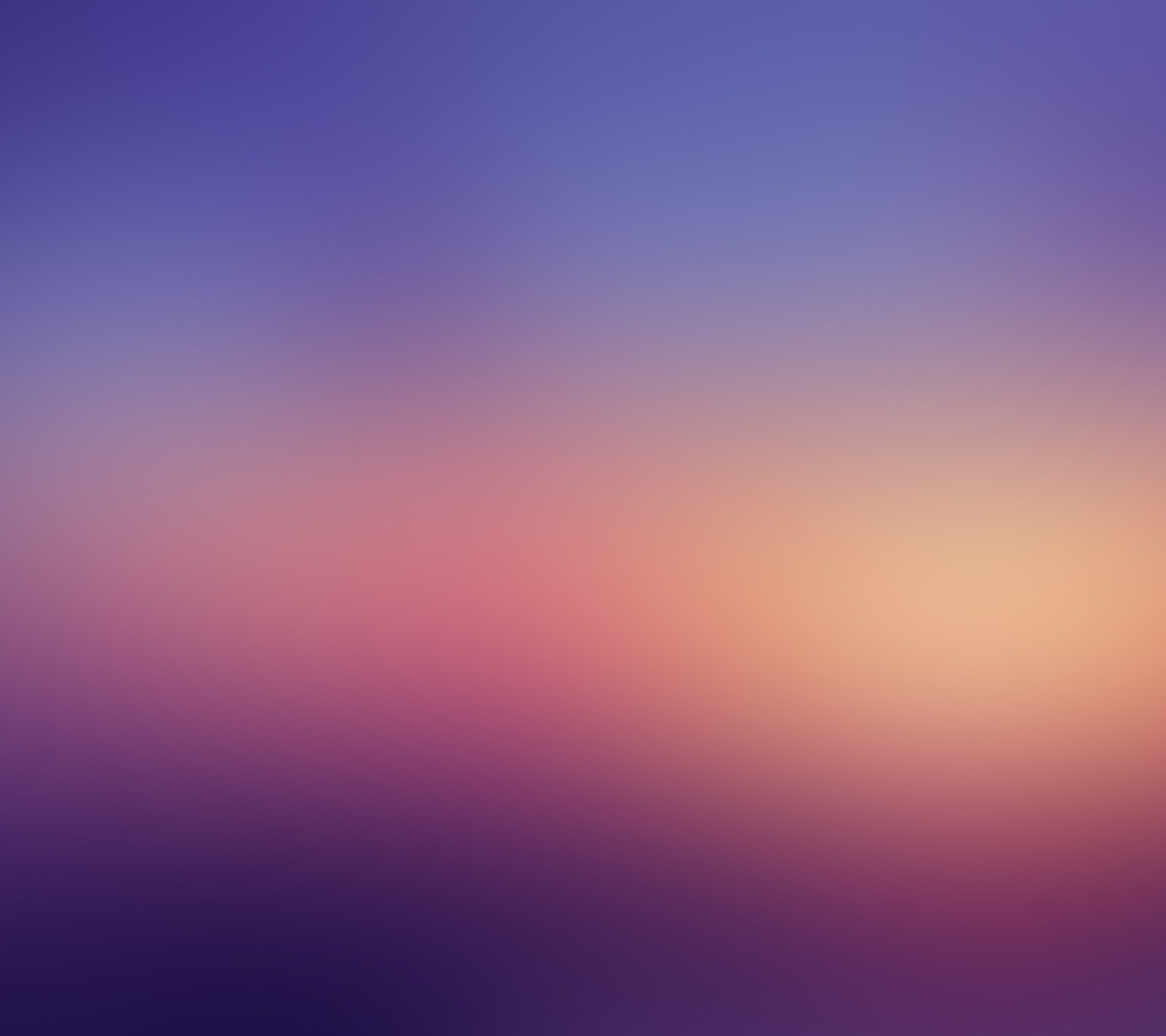 Blurred background of a purple and orange sky with a single airplane (abstract, blur)