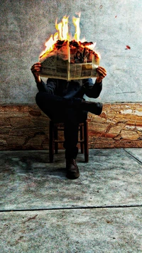 Man Holding Burning Newspaper: A Symbol of Fake News and Ignition