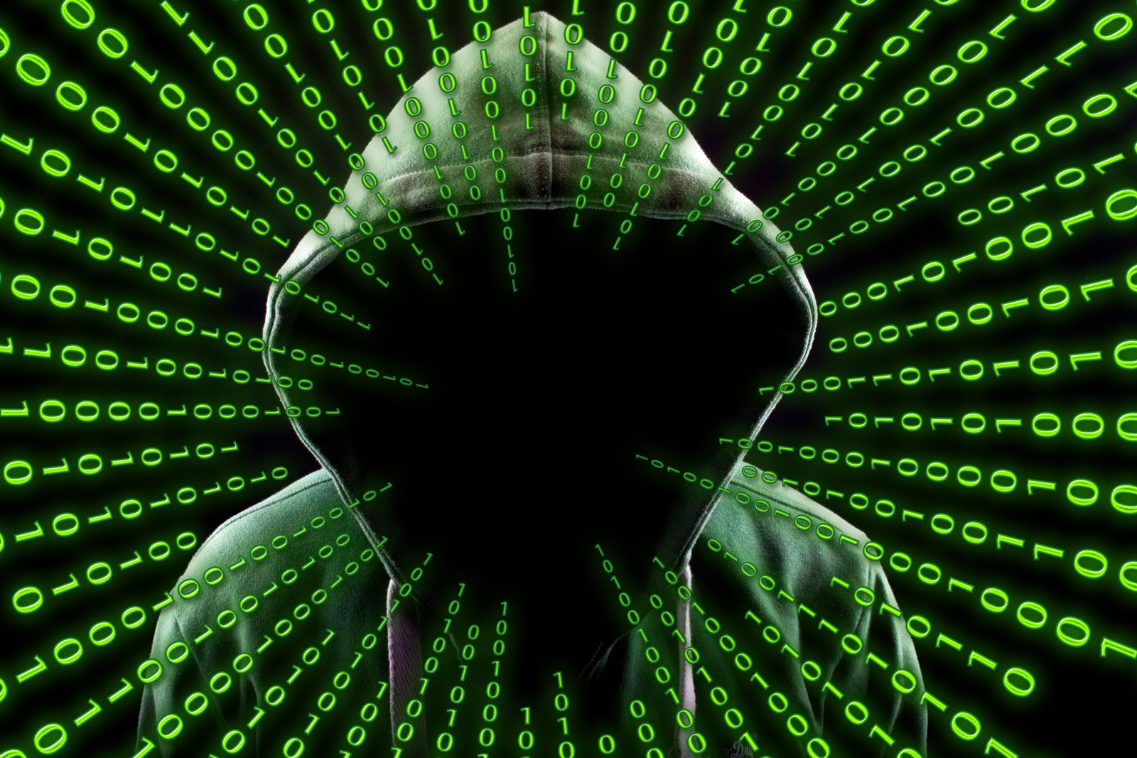 A person in a hoodie is surrounded by green numbers (hacker, matrix code, binary, coding, hoodie)