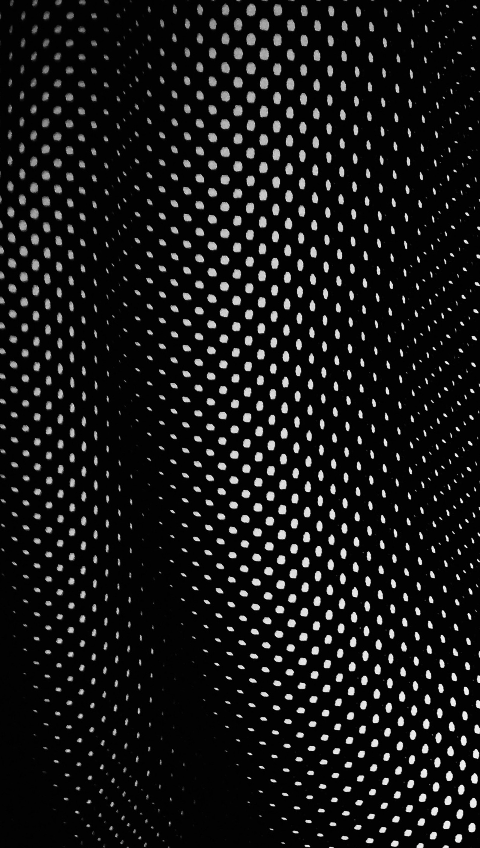 A close up of a black and white photo of a metal surface (3d, black, clean, dark, dots)