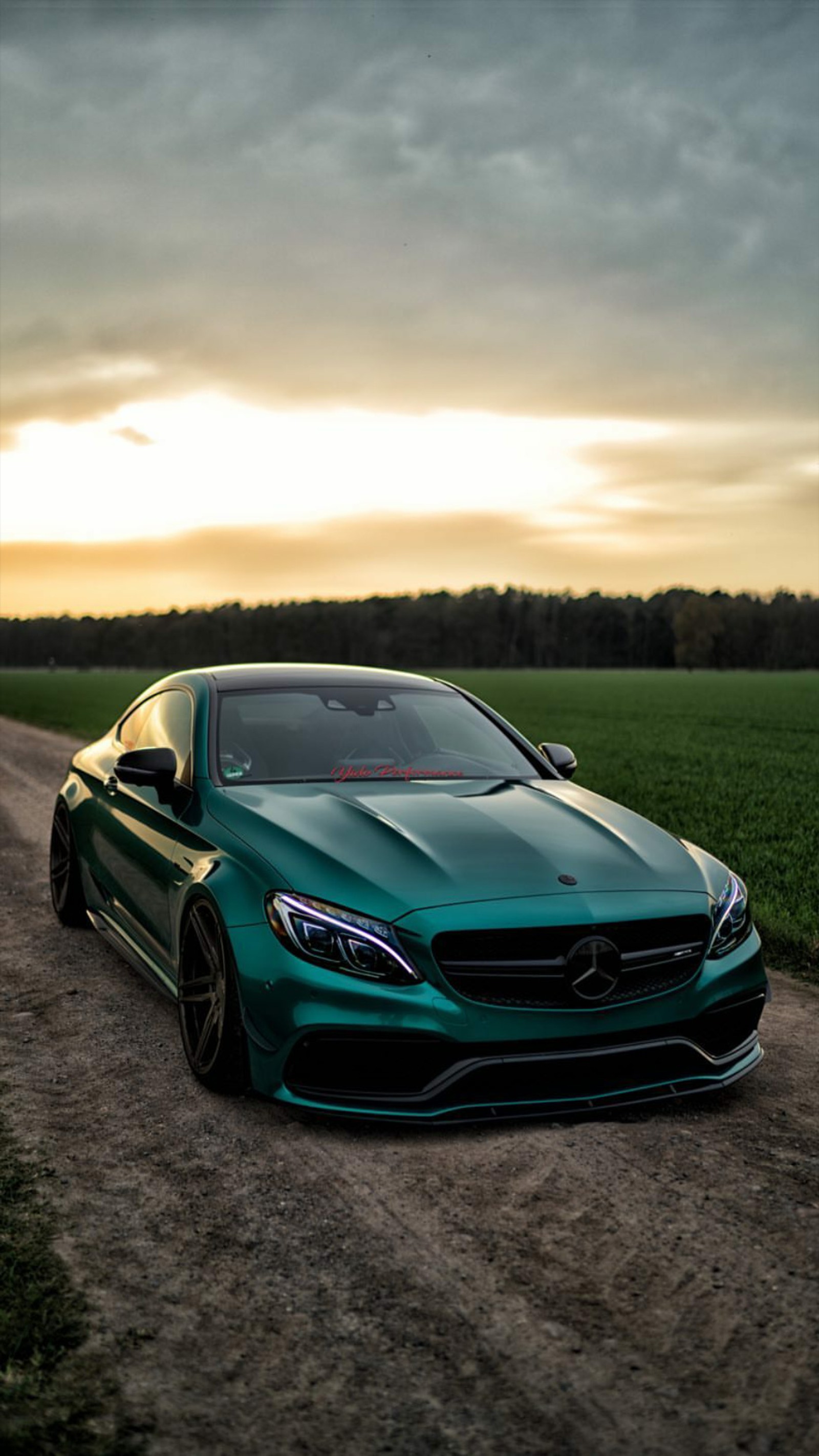 A close up of a green car parked on a dirt road (mercedes, amg, green, car, supercar)