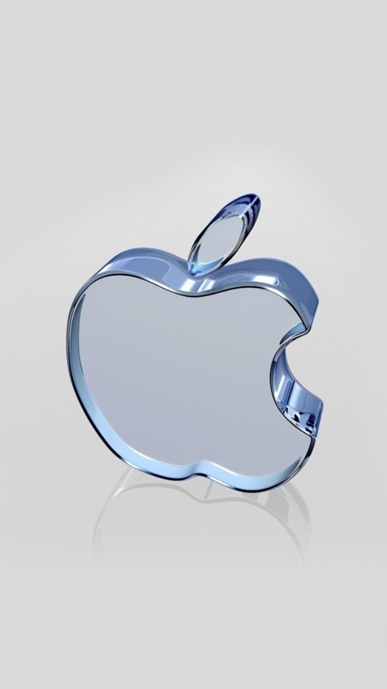 Il y a un logo apple brillant sur une surface blanche (verre, pomme)