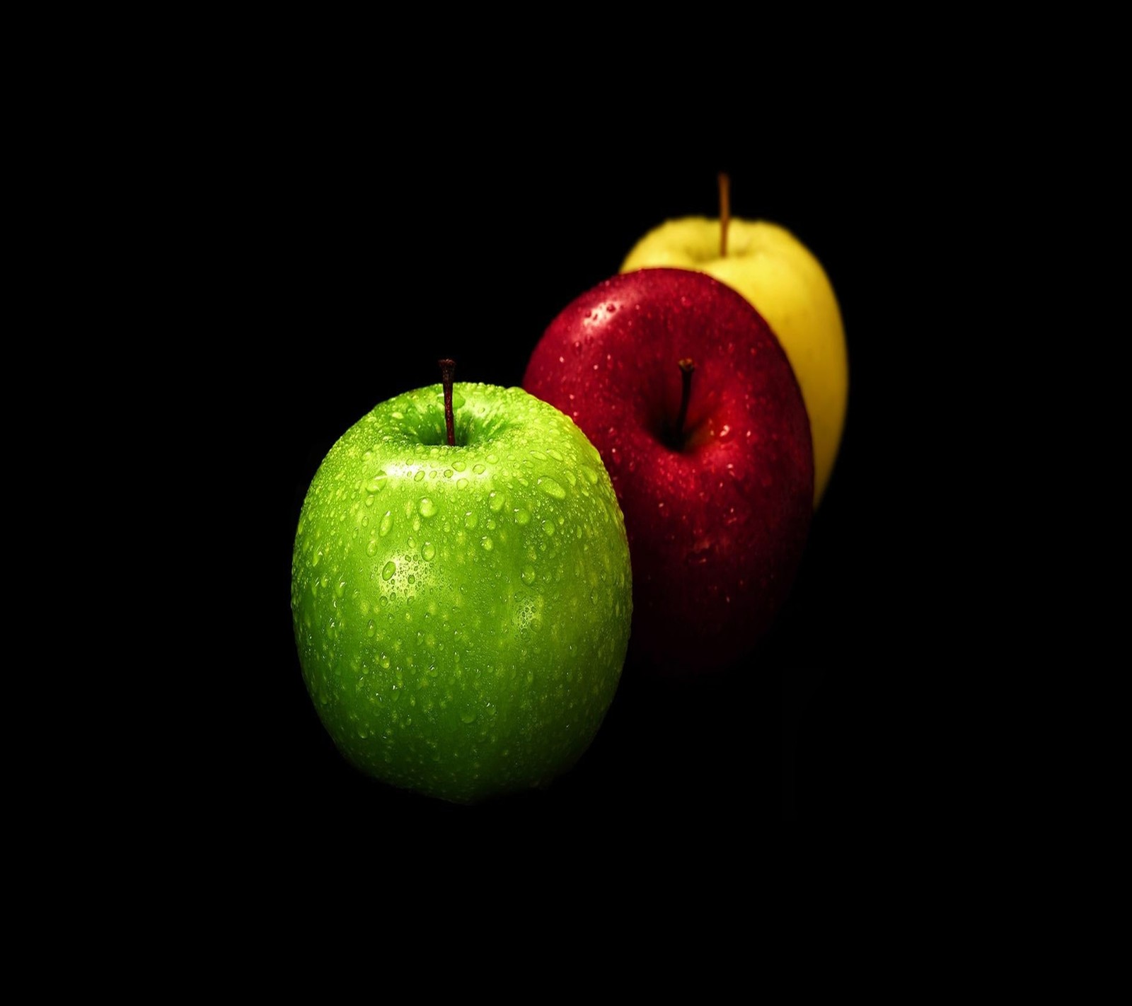 There are three apples that are sitting side by side (apple, background, black, cool, fresh)