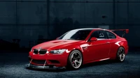 Sleek Red BMW M3 E92: A High-Performance Sports Car Masterpiece.