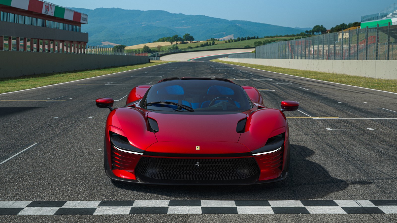 A red sports car driving on a race track with mountains in the background (ferrari daytona sp3, 5k, sports cars, supercars, race track)