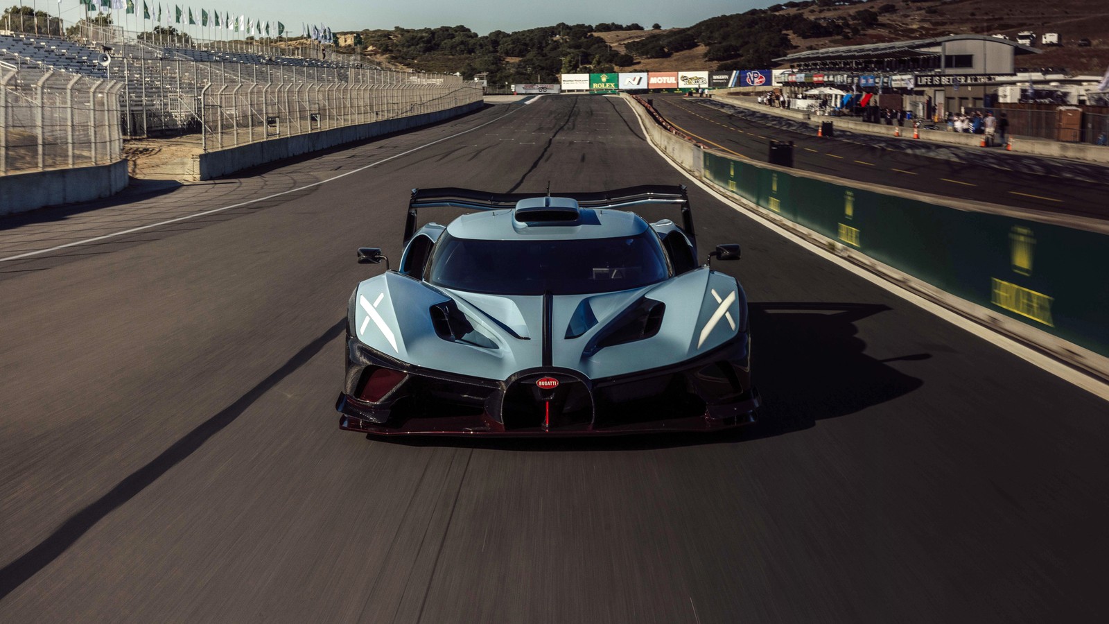 A blue and white car driving on a race track (bugatti bolide, 2024, anniversary edition, 5k, race track)