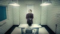 Joker Confronts Harley Quinn in a Stark Interrogation Room