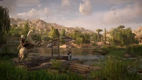 Scenic wetland landscape with a character on a mount beside a tranquil water body, featuring lush greenery and distant ruins, inspired by the world of Assassin's Creed.