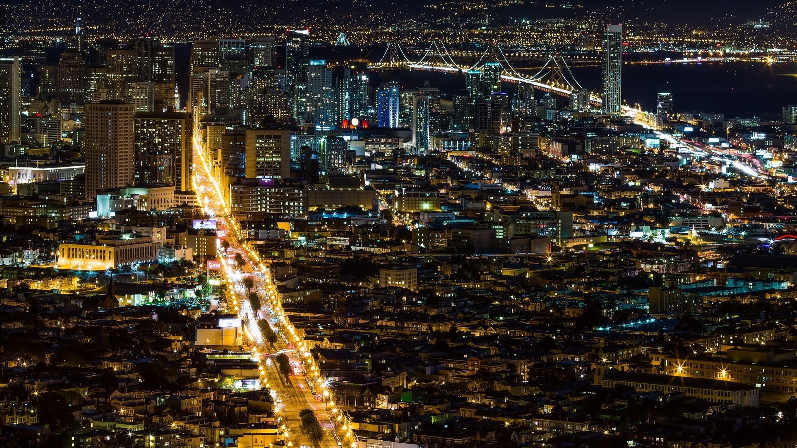 Uma vista da cidade à noite com uma ponte ao fundo (paisagem urbana, cidade, área urbana, metrópole, noite)