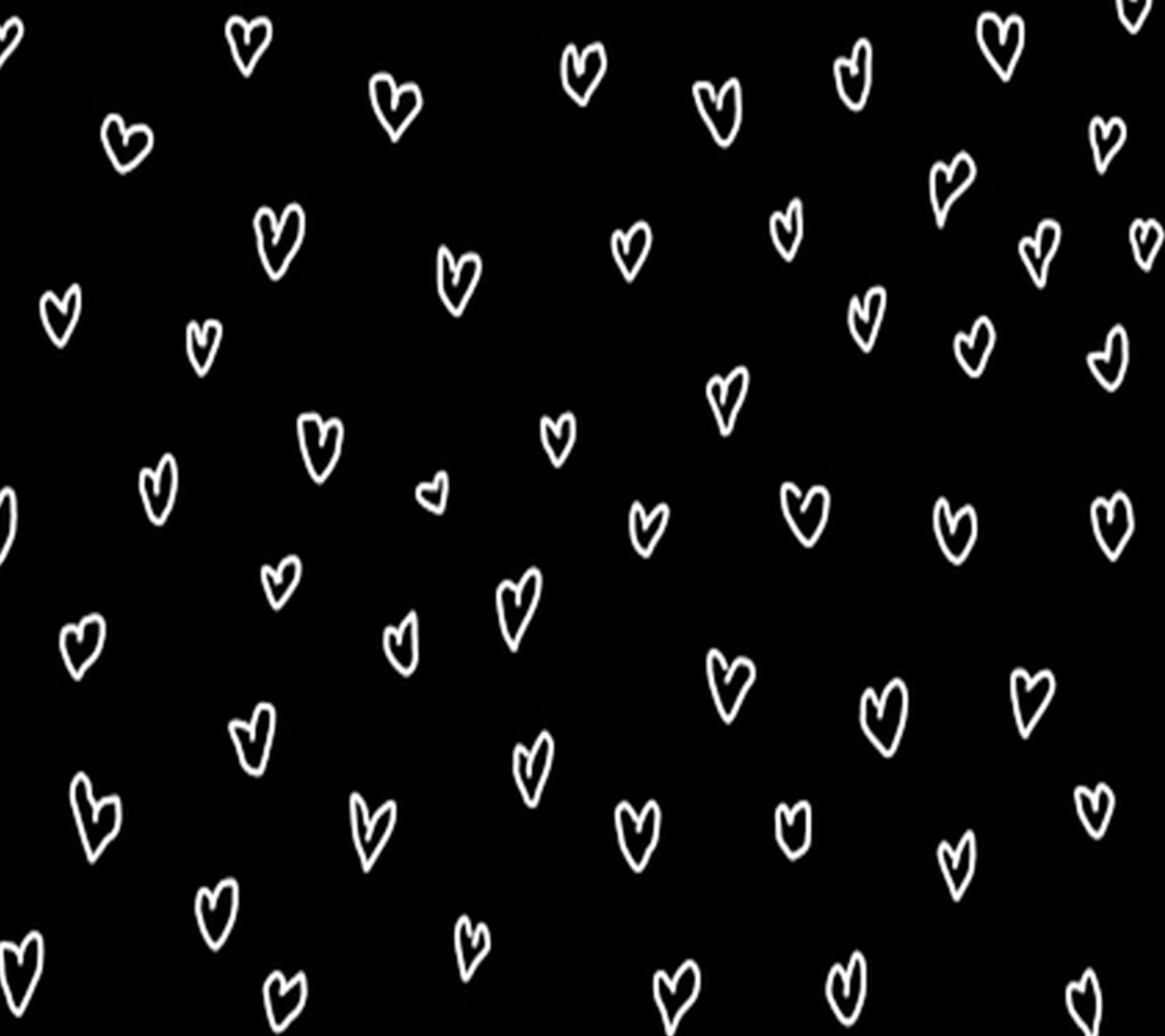 A close up of a black and white background with hearts (hearts, white)