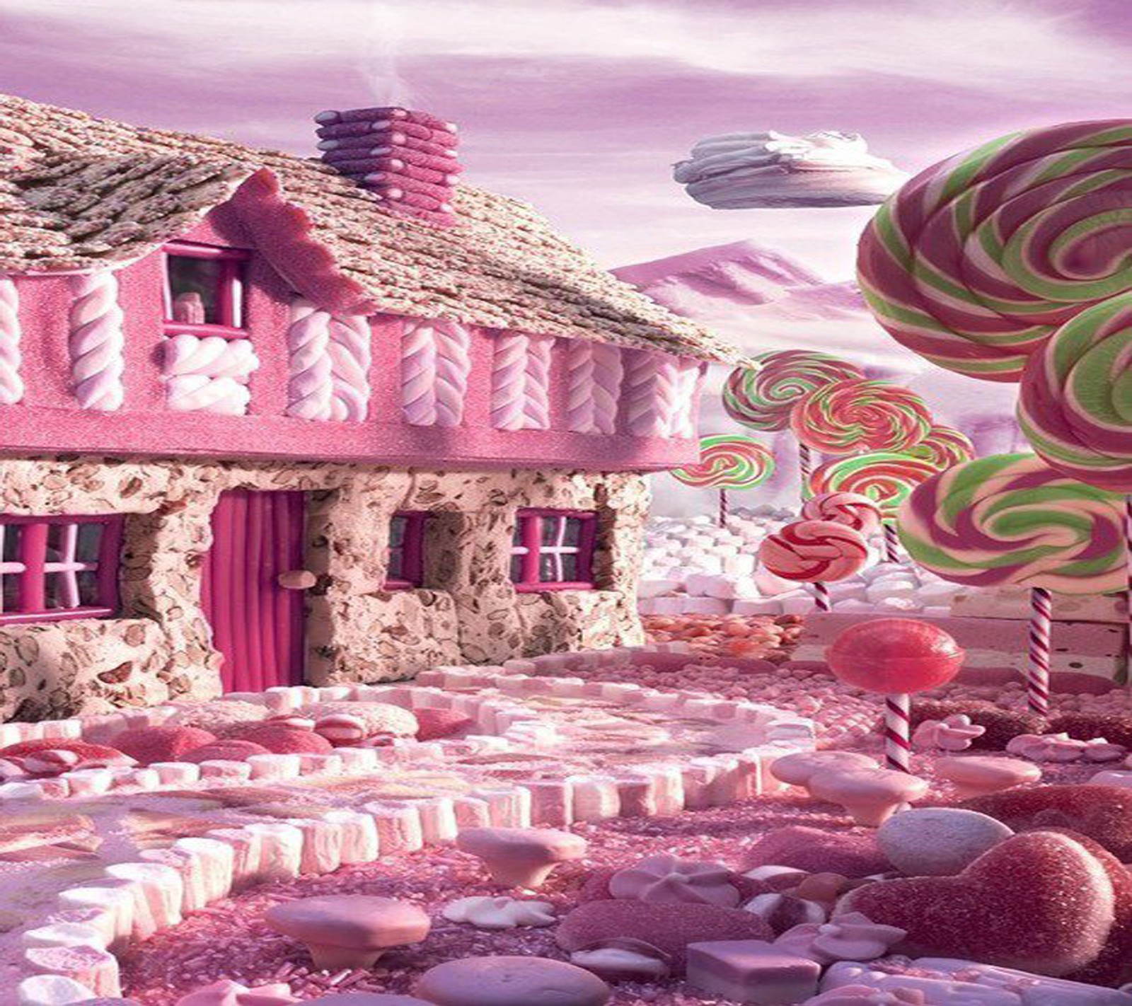 Il y a une maison rose avec beaucoup de bonbons sur le sol (bonbons, terre)