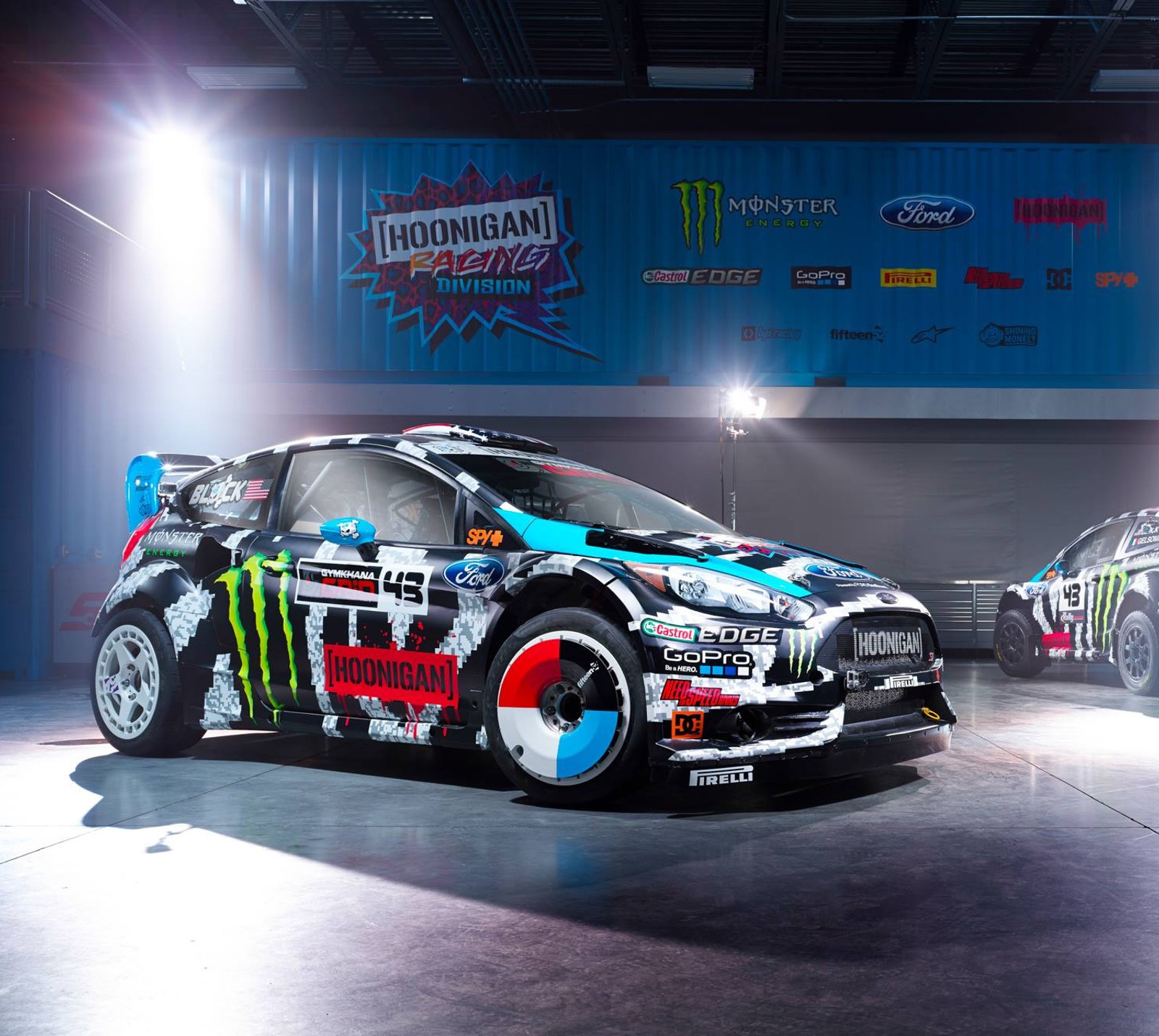 Arafed car with a monster livery parked in a garage (drifting, ford, ken block)