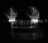 Elegant Black Audi with Water Effects