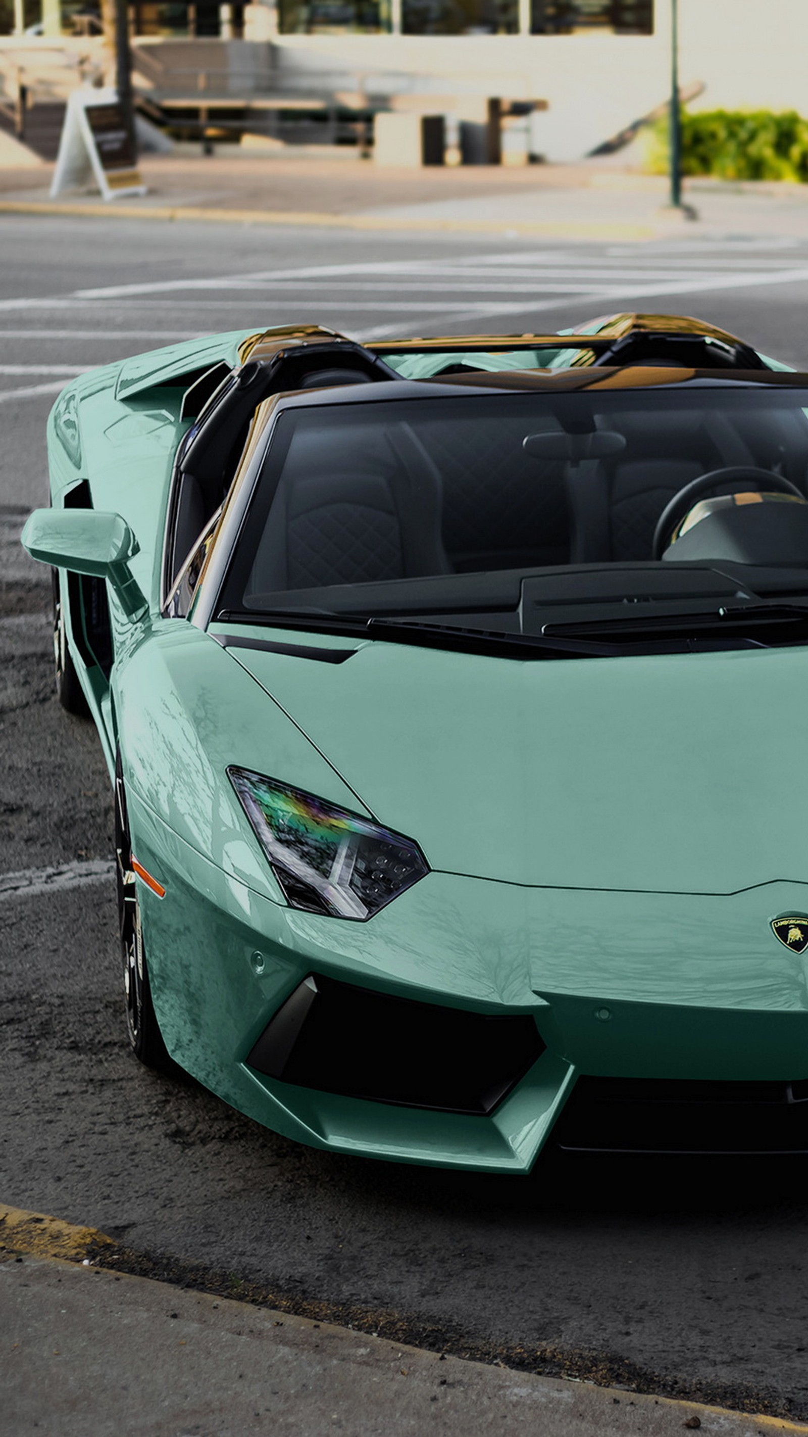 A close up of a green sports car parked on a street (lamborghini, lamborghini aventador sv, lamborghini gallardo, cars, lamborghini huracan)