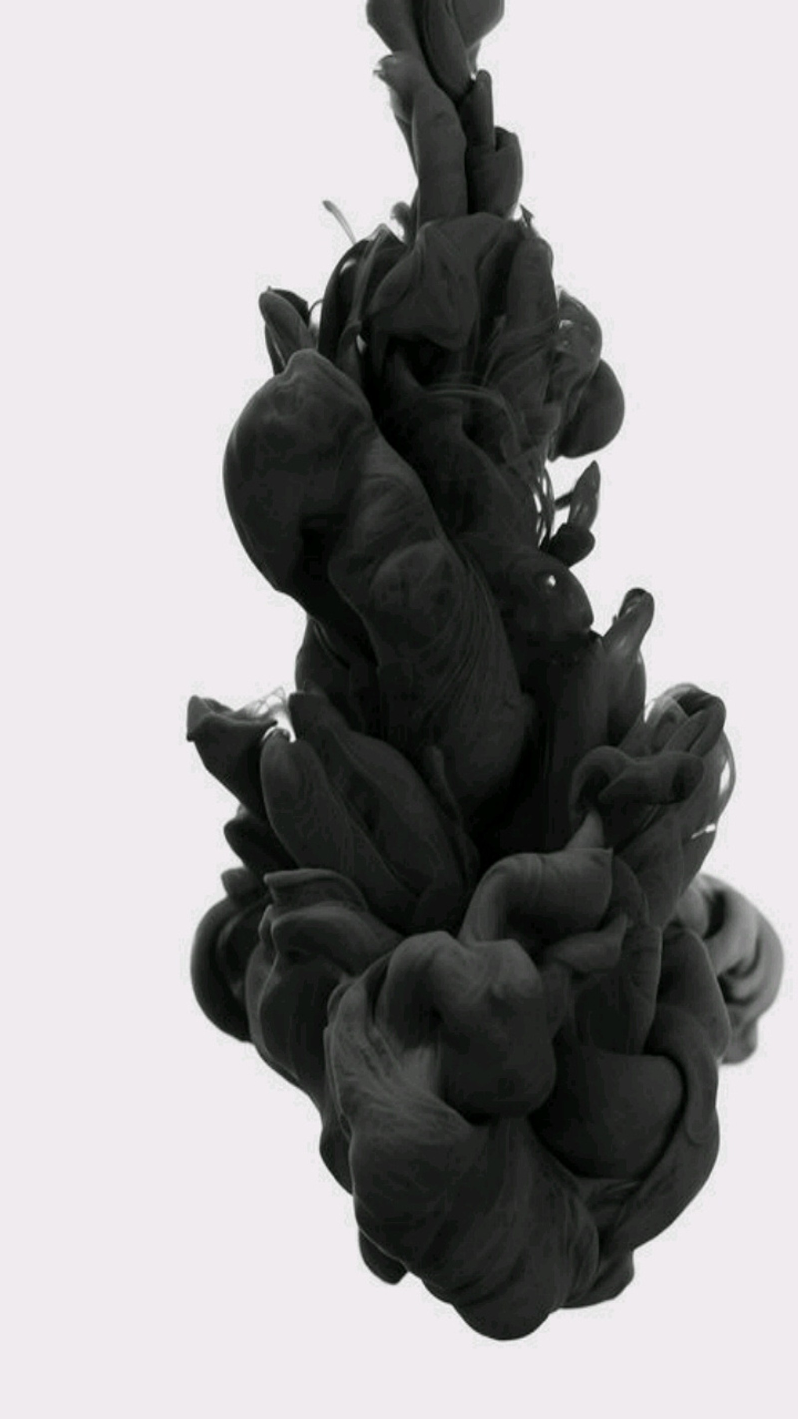 A close up of a black ink substance in the water (ink, smoke, abstract)