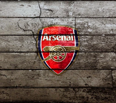 Logo d'Arsenal FC sur fond en bois rustique