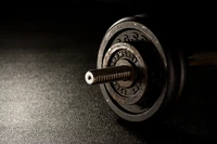 Close-Up of a Dumbbell on a Dark Surface