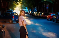 Street Fashion Elegance: A Model Bathed in Night Light