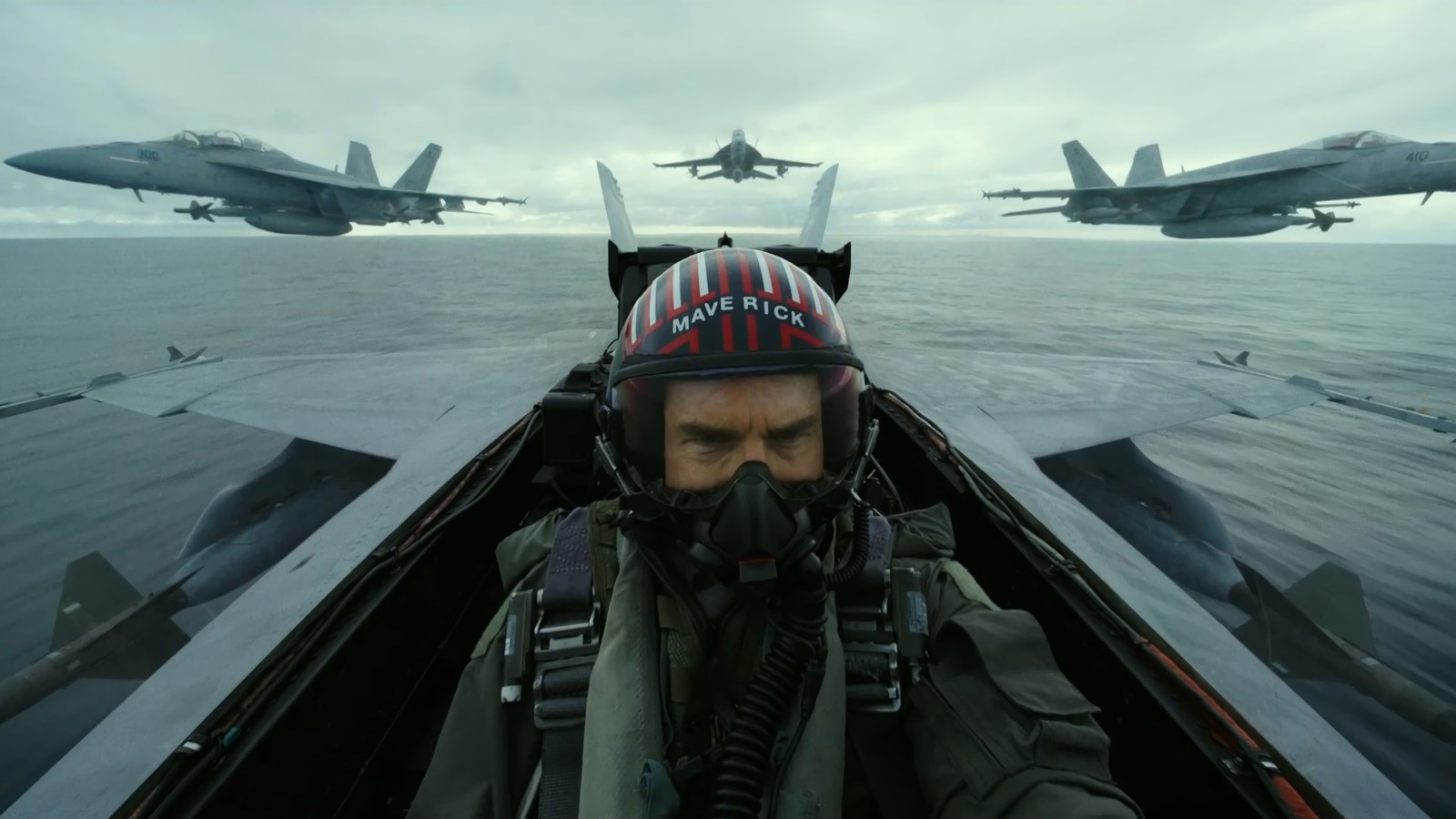 Arafed fighter in a boat with fighter jets flying in the background (top gun 2, top gun maverick, movie, tom cruise)