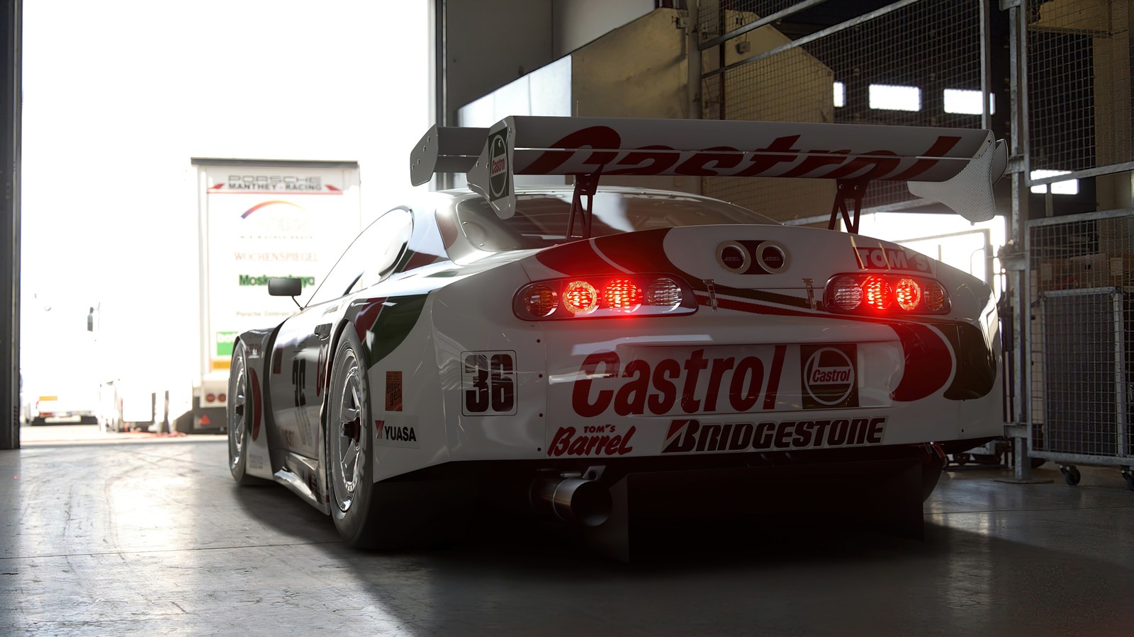 Il y a une voiture blanche avec des lumières rouges dans un garage (gran turismo 7, jeu vidéo, voiture)