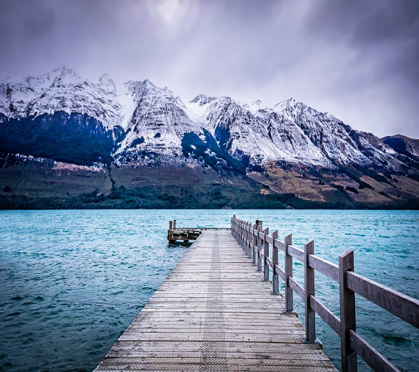 Arafed wooden pier with mountains in the background (beautiful, nature, wallpapers)