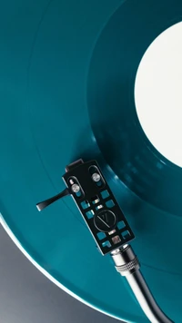 Stylish Vinyl Turntable on Turquoise Record