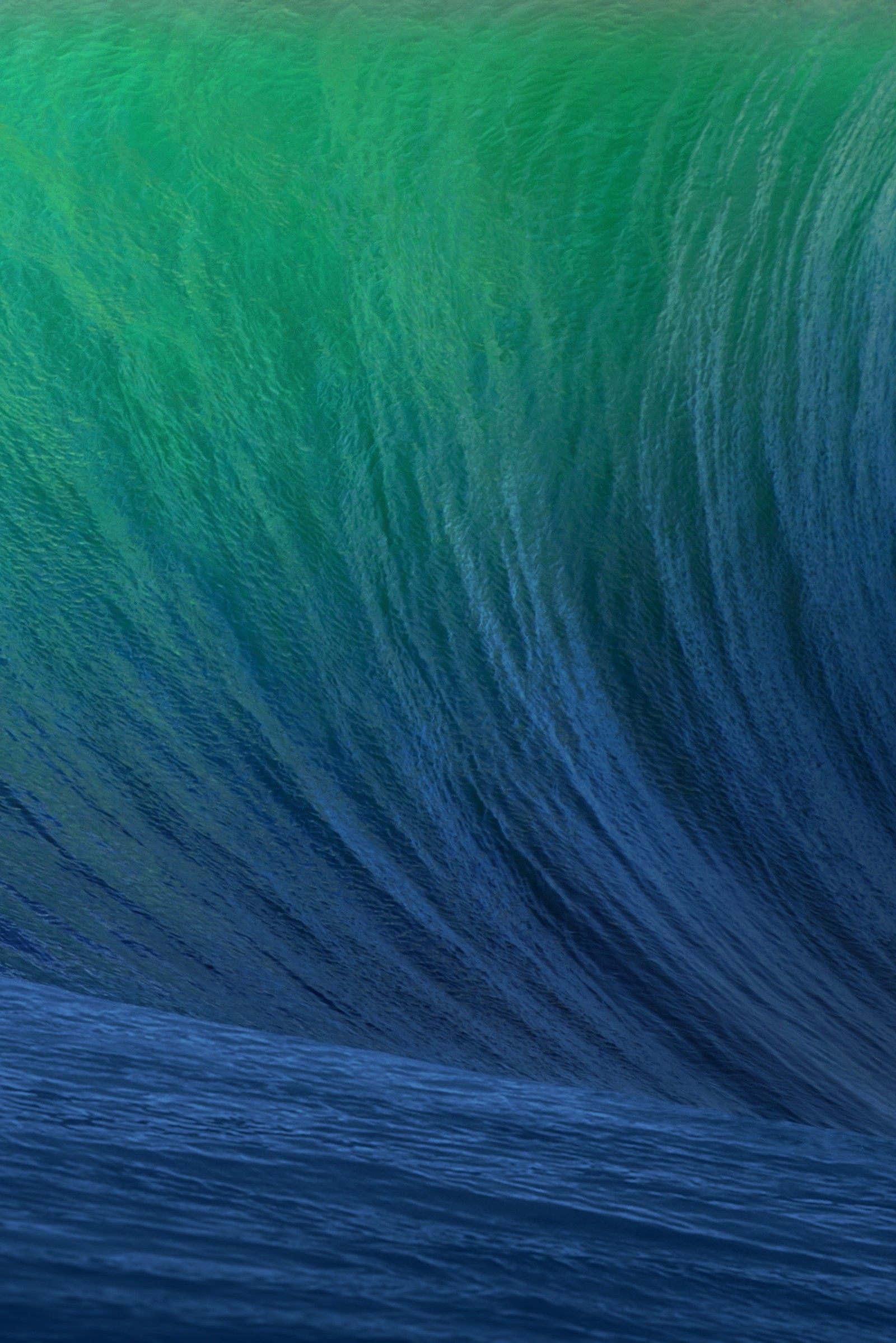 Surfer riding a large wave in the ocean on a blue green green ocean (apple, osx)