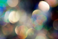 Efecto bokeh con círculos de luz coloridos y destello de lente