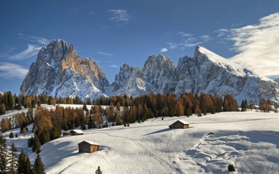 Maravilha de inverno nos Alpes: Picos cobertos de neve e cabanas rústicas