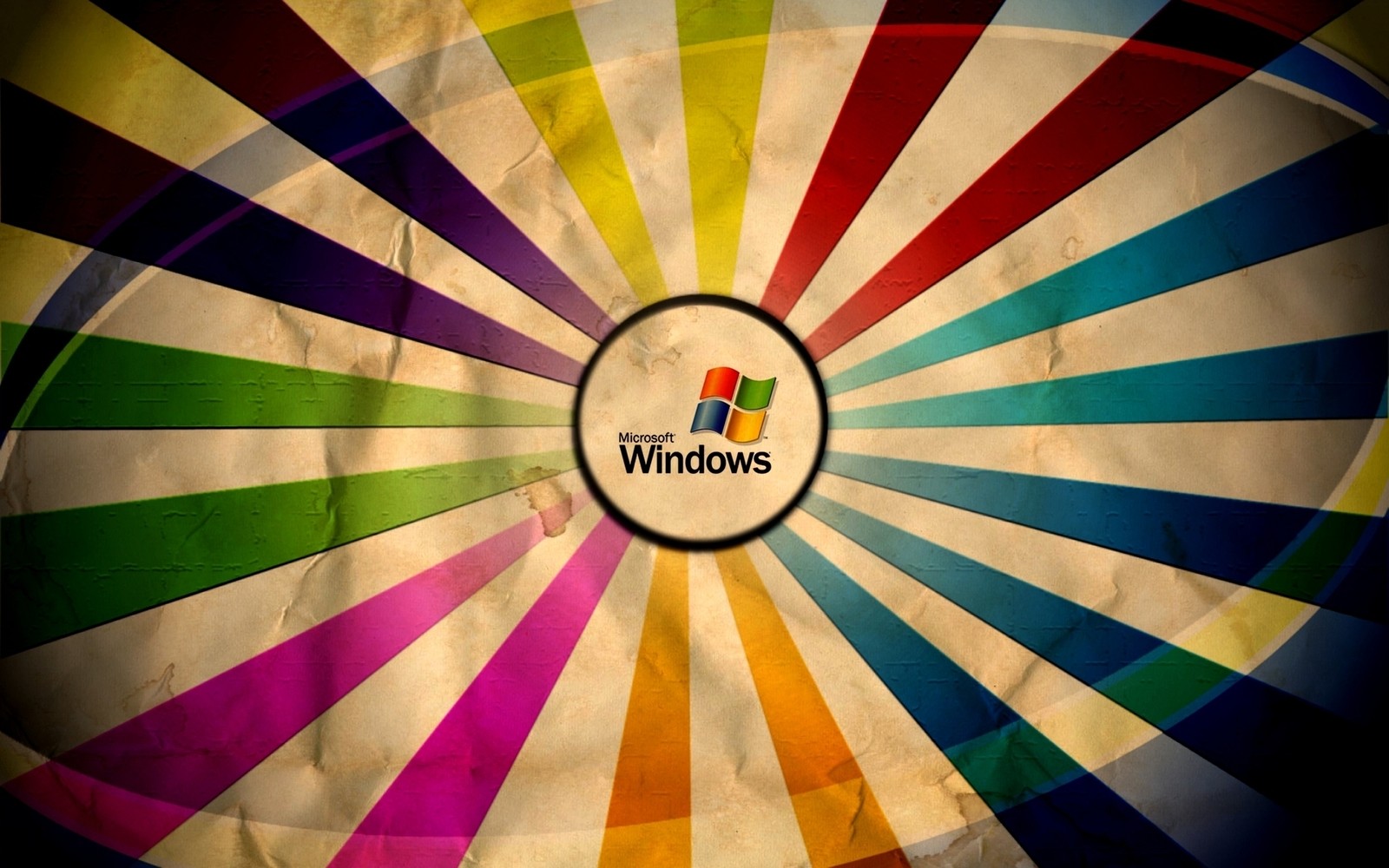 A close up of a colorful wheel with a windows logo on it (circle, symmetry, graphic design, windows, font)