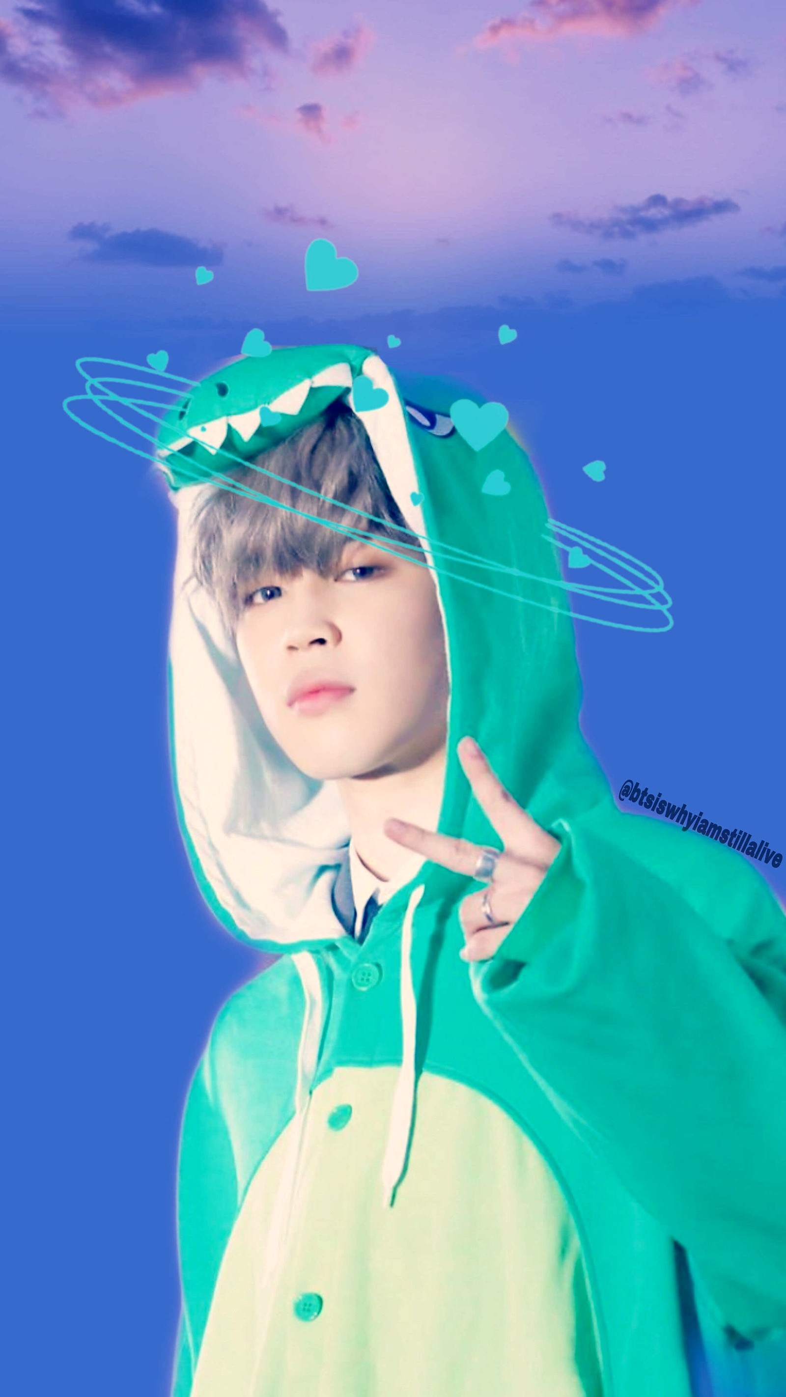 Gros plan d'une personne portant un costume vert et blanc (bts, park jimin)