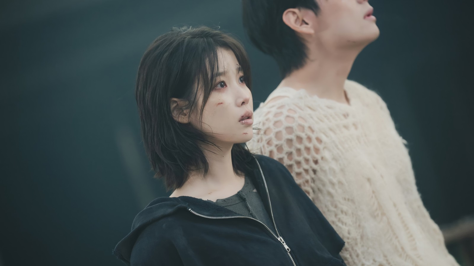 Two asian women standing next to each other in a dark room (iu, k pop, kpop, 아이유, lee ji eun)