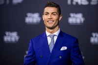 Cristiano Ronaldo at "The Best" awards ceremony in a stylish blue suit.