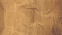 Crinkled Brown Paper Texture on a Wooden Surface