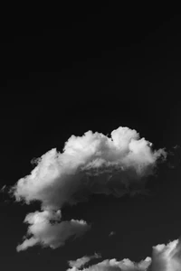 Cumulus Clouds Against a Black Sky at Sunset