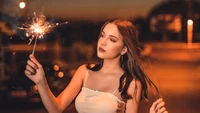 Elegant Model Holding a Sparkler at Dusk