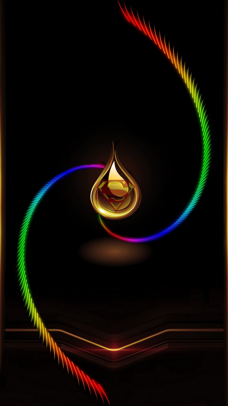 A close up of a colorful spiral with a candle in the middle (colors, drop, superman logo)