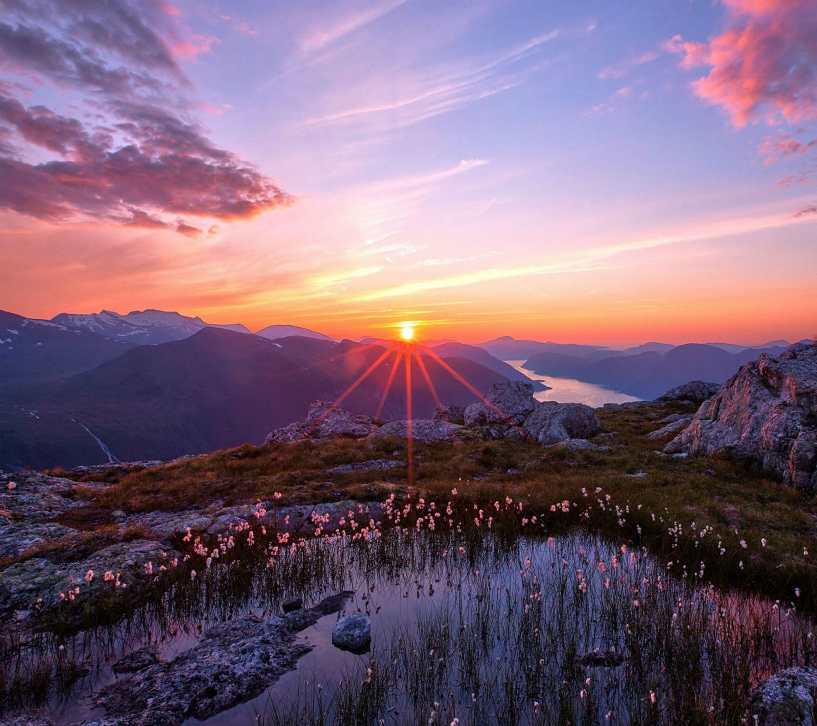 Arafed view of a sunset over a mountain with a lake (2013, 3d, colorful, evening, flower)