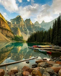 Colorful Kayaks on a Serene Mountain Lake Surrounded by Majestic Forests