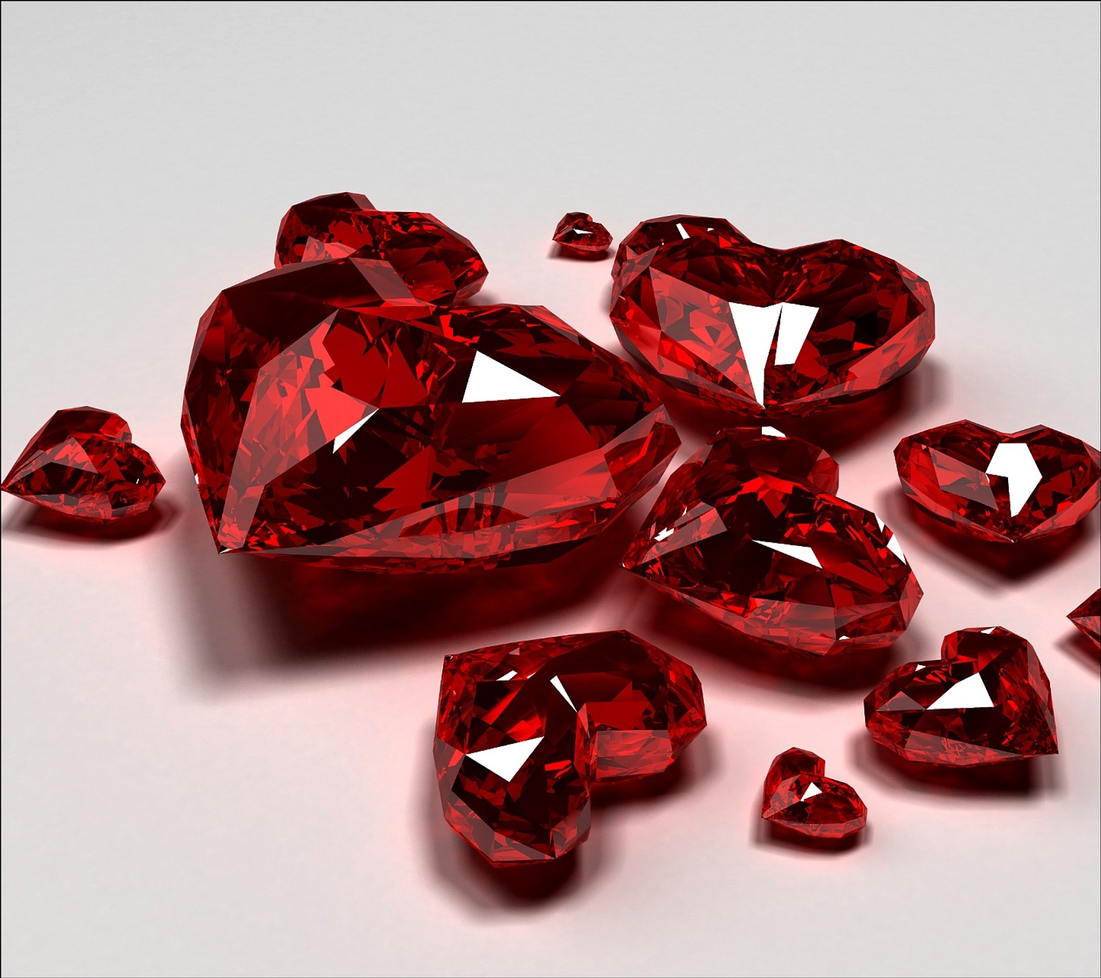 A close up of a bunch of red diamonds on a white surface (hearts, red)