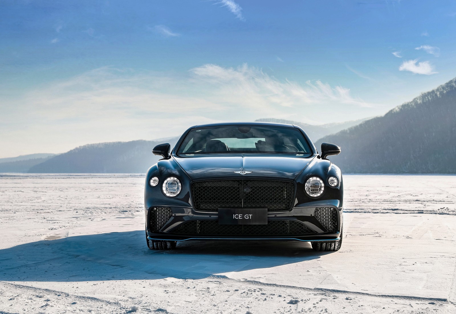 A close up of a bentley car parked on a snowy surface (bentley continental gt v8 ice gt, 2022, 5k, cars, 4k wallpaper)