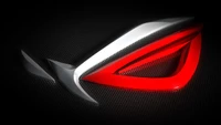 Logotipo ASUS ROG: Uma fusão ousada de vermelho e prata em um fundo texturizado