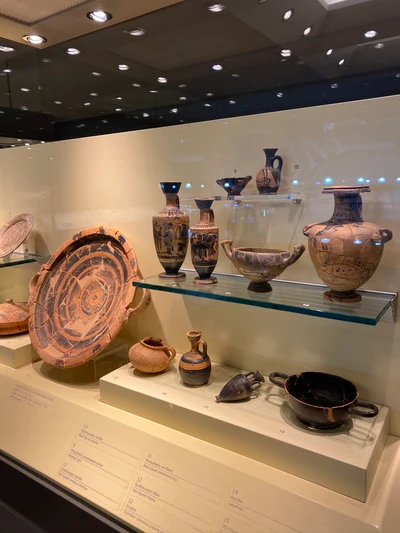 Ancient Ceramic Serveware Collection Displayed in Museum Exhibit