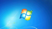 Fond d'écran officiel de Windows 7 avec un logo vibrant sur fond bleu