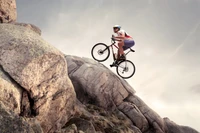 Mountain Biker Executing a Freeride Jump Over Rocky Terrain