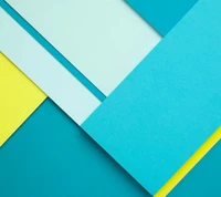 Colorful geometric paper layers in shades of blue, mint, and yellow.