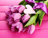 Heartfelt Bouquet of Purple Tulips on a Vibrant Pink Background