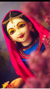 Idol of Radha adorned in vibrant attire, radiating grace and devotion