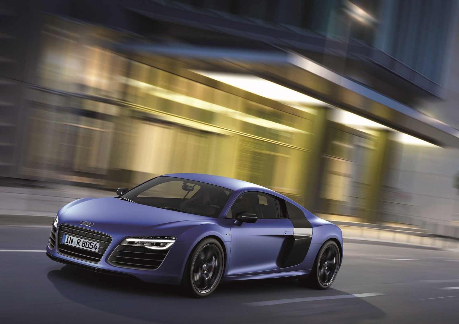 A blue audi sports car driving down a city street (audi r8, car, v10 engine, audi, sports car)